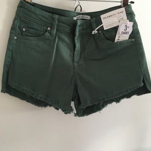 3” Green frayed denim shorts. Size 26